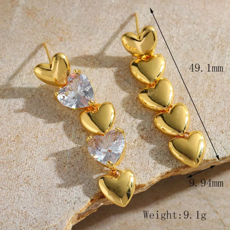 Hochwertige Edelstahl Herz-Ohrhänger in Gold mit Zirkonia. Nickelfrei, edel, wasserfest und langlebig.