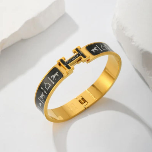 Armreif mit Symbolen in Schwarz