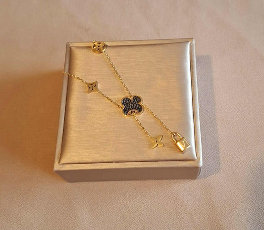 Zweireihige Kette mit Klee, Blume, Raute & Schloss