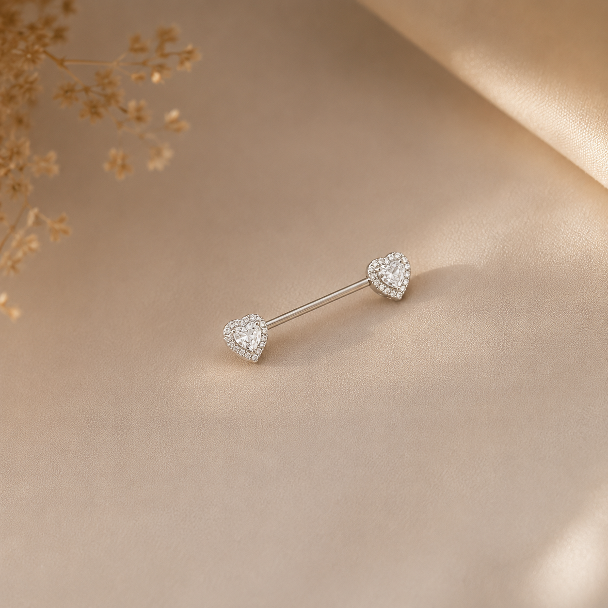 Hochwertiges Edelstahl Brustwarzen-Piercing  mit funkelnden Zirkonia-Kugeln in modernen Design. Langlebig, nickelfrei, glanzbeständig und wasserfest.