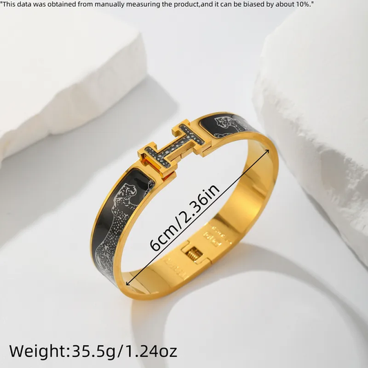 Armreif mit Symbolen in Schwarz