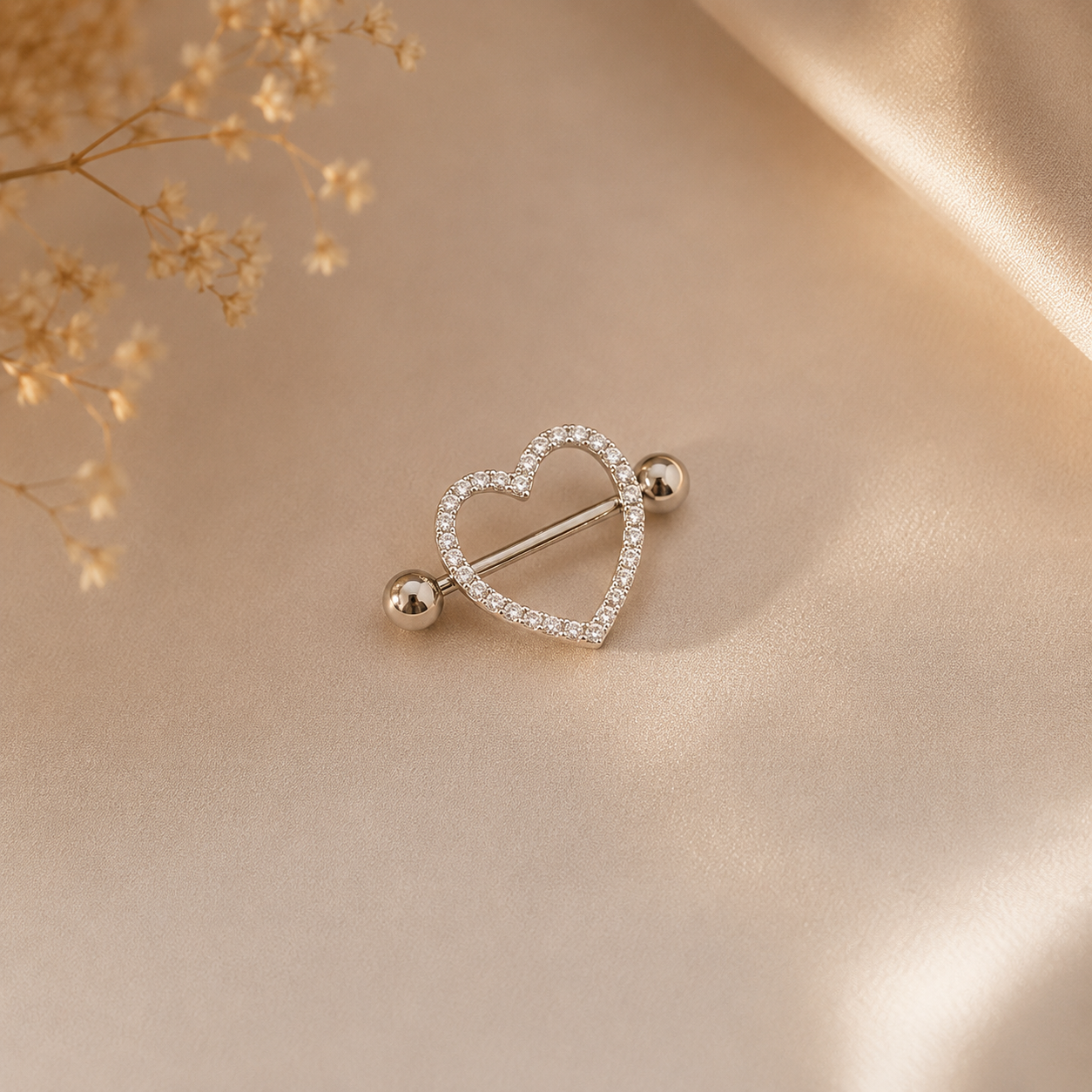 Hochwertiges Edelstahl Brustwarzen-Piercing  mit funkelnden Zirkonia-Kugeln in modernen Design. Langlebig, nickelfrei, glanzbeständig und wasserfest.